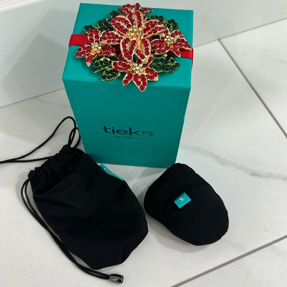 Tieks box with special poinsettia topper, shoe bag and packable tote.